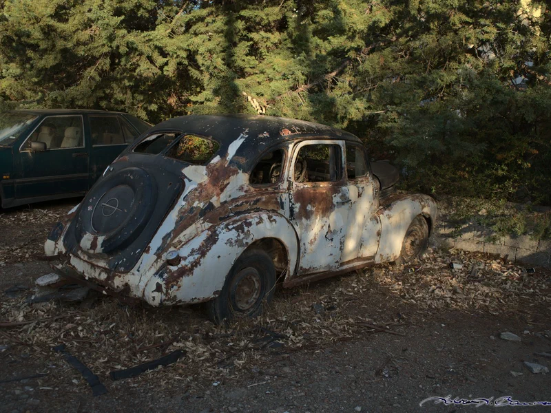 A long abandoned car in a nearby parking lot. The ratio between still active cars and derelicts in there was about 1:1.