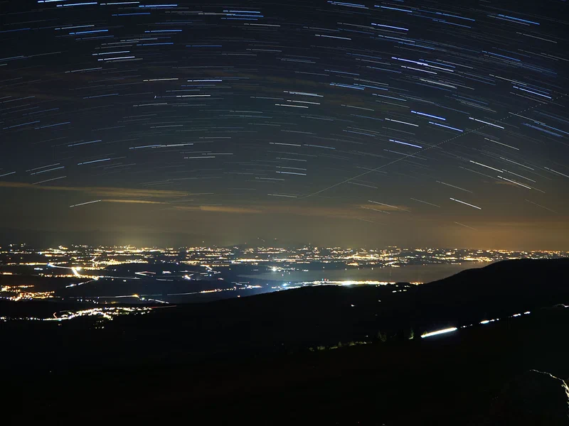 Chasseral, August 14, 2017. There's one Perseid meteor in the upper left quadrant of the image, and an aeroplane flying off towards the centre. The gap in the stars is due to one image in the stack being unusable - some idiot shone his car's headlights right into the camera.